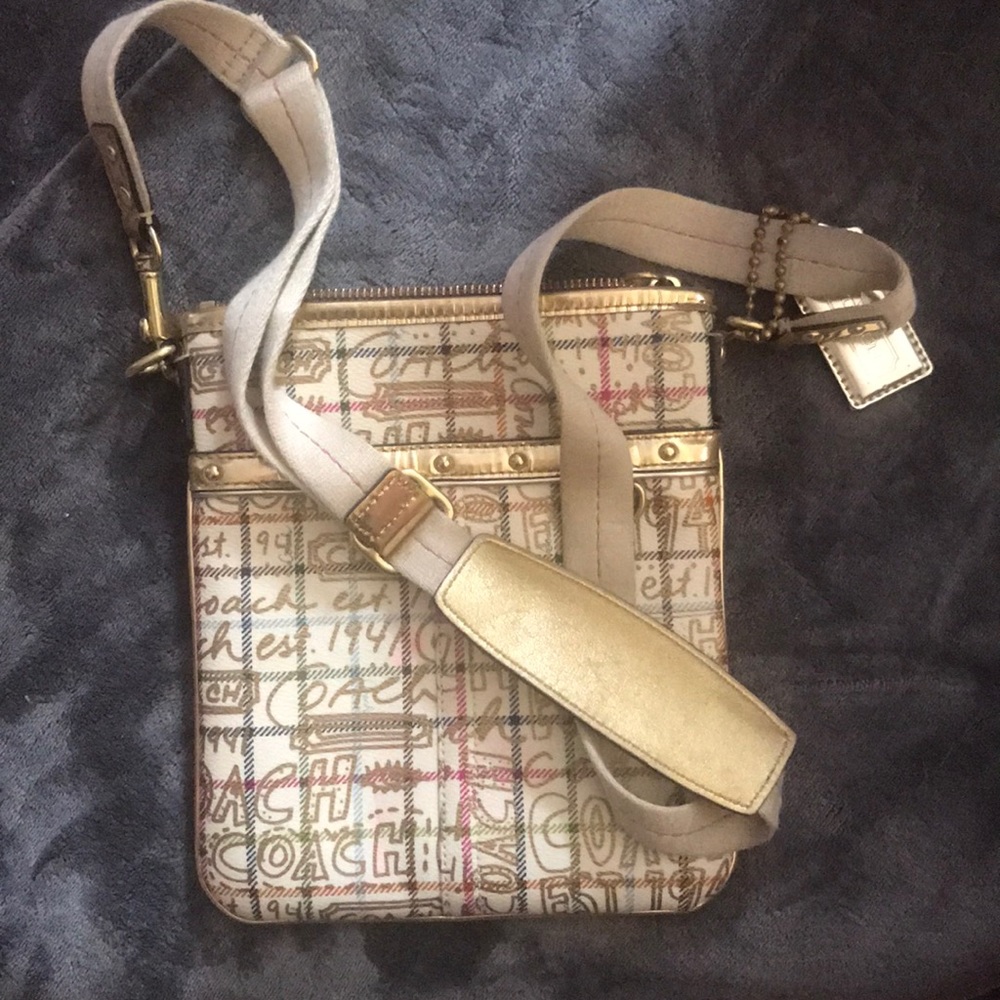Woman’s Coach cross body purse